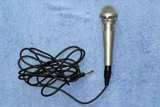 Karaoke microphone on a table, for an article about videoke mobile app features.